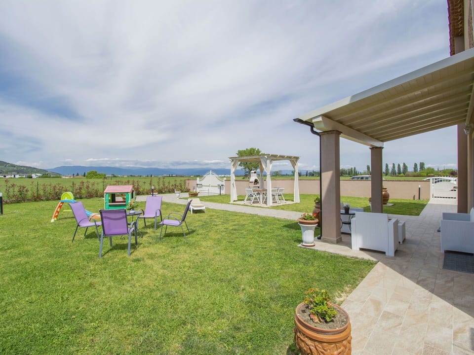 Sky, Cloud, Plant, Land Lot, Chair, Grass, Shade, Outdoor Furniture, Flowerpot, Landscape