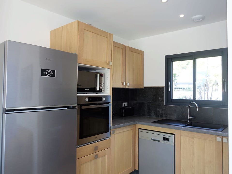 Cabinetry, Countertop, Property, Sink, Kitchen Sink, Kitchen Appliance, Kitchen Stove, Building, Wood, Window