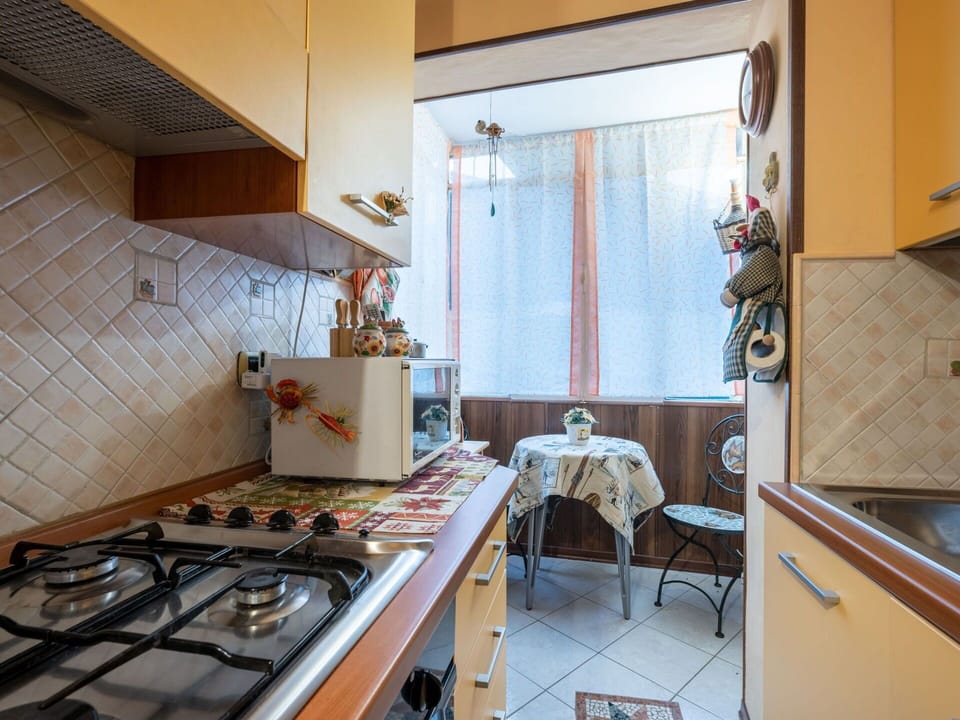 Furniture, Cabinetry, Property, Countertop, Table, Gas Stove, Chair, Kitchen, Interior Design, Kitchen Stove