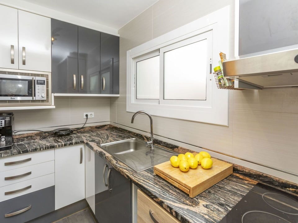 Kitchen, Countertop, Kitchen Appliance, Cabinetry, Major Appliance, Wood, Flooring, Interior Design, Stove, Kitchen Stove
