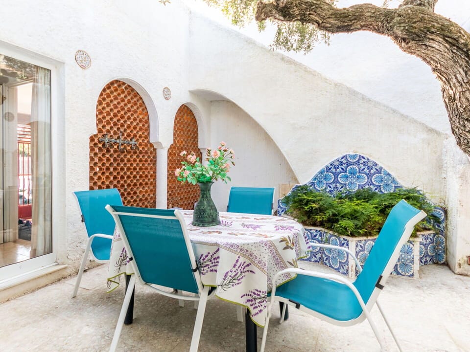Furniture, Plant, Property, Table, Building, Chair, Azure, Interior Design, Outdoor Furniture, Decoration