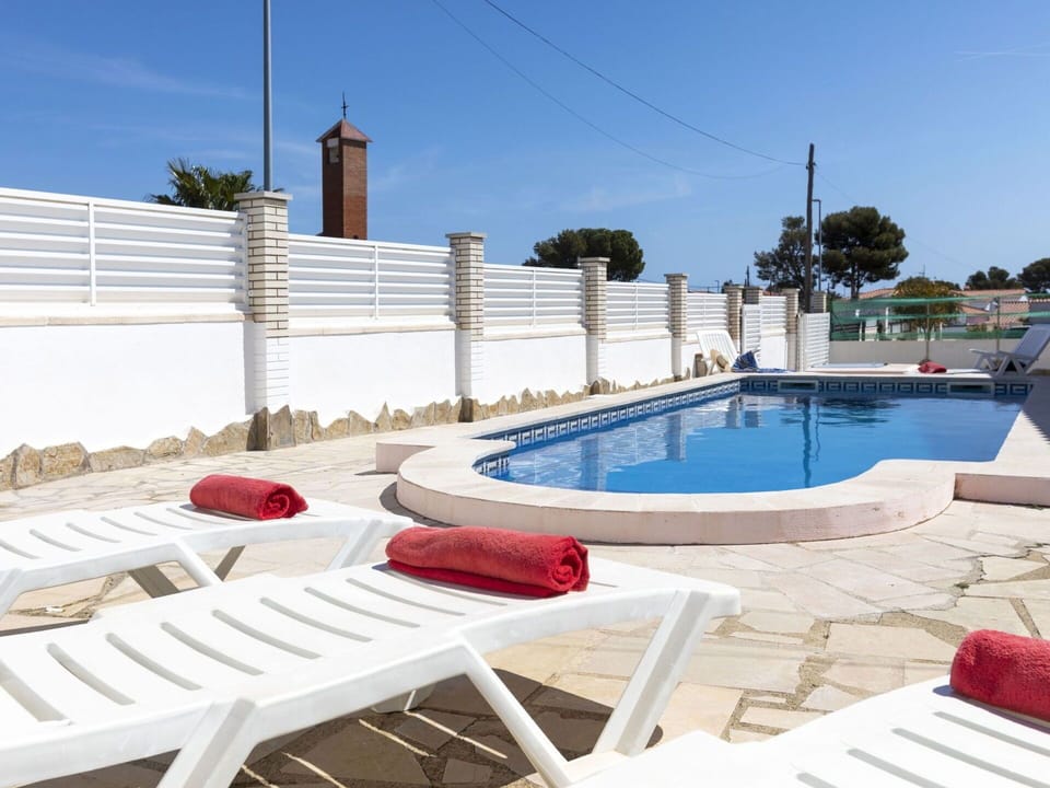Water, Sky, Property, Swimming Pool, Azure, Outdoor Furniture, Shade, Building, Sunlounger, Leisure