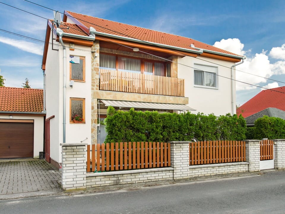 Sky, Cloud, Building, Window, Plant, House, Wood, Land Lot, Neighbourhood, Fence