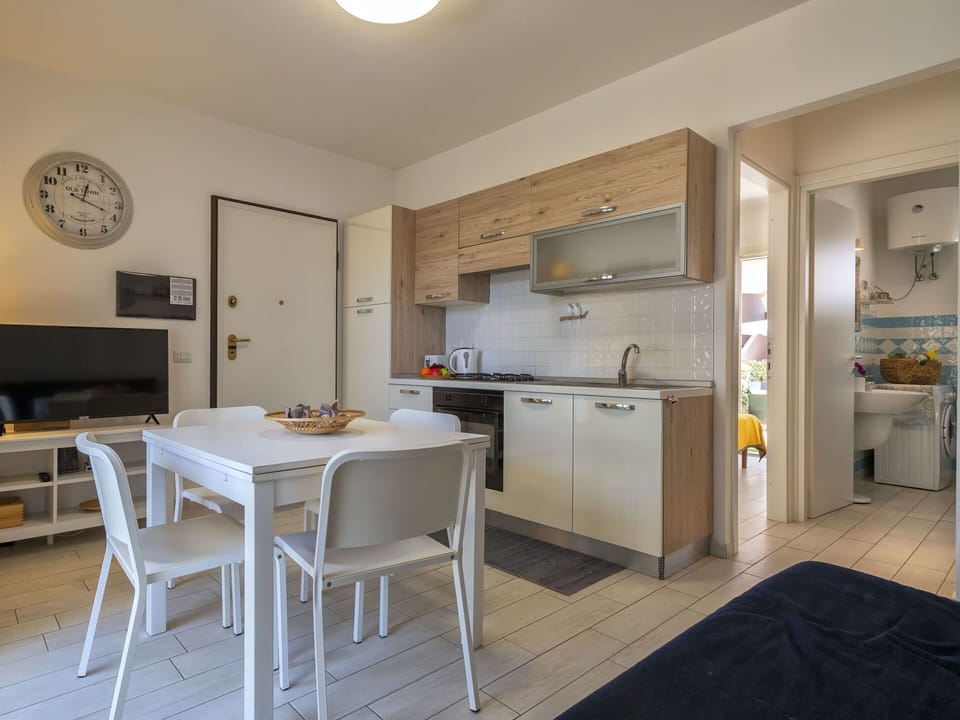 Furniture, Cabinetry, Table, Countertop, Chair, Kitchen, Wood, Interior Design, Kitchen Appliance, Clock
