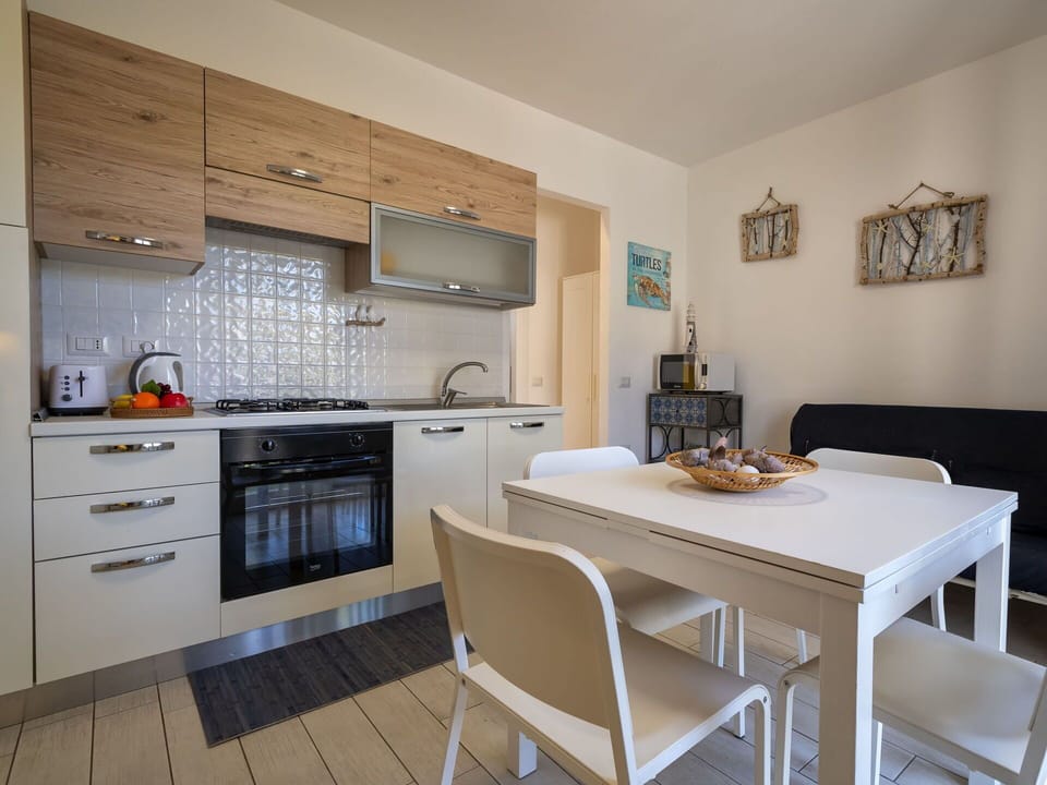 Furniture, Cabinetry, Countertop, Kitchen Stove, Wood, Table, Kitchen Appliance, Chair, Interior Design, Floor