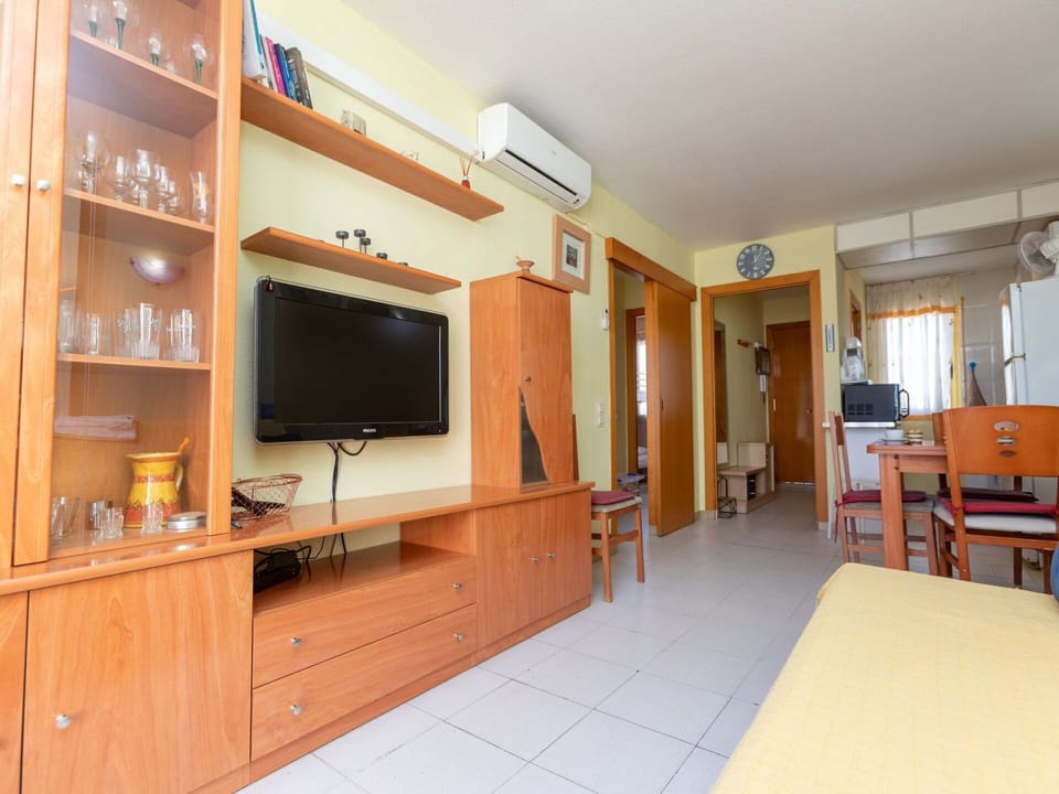 Furniture, Table, Cabinetry, Chair, Building, Orange, Television, Wood, Interior Design, Home Appliance