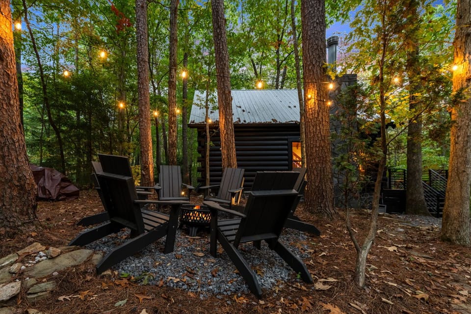 Gather around the fire pit amidst hemlocks and twinkling lights - Where nature, stories, and laughter create unforgettable memories.