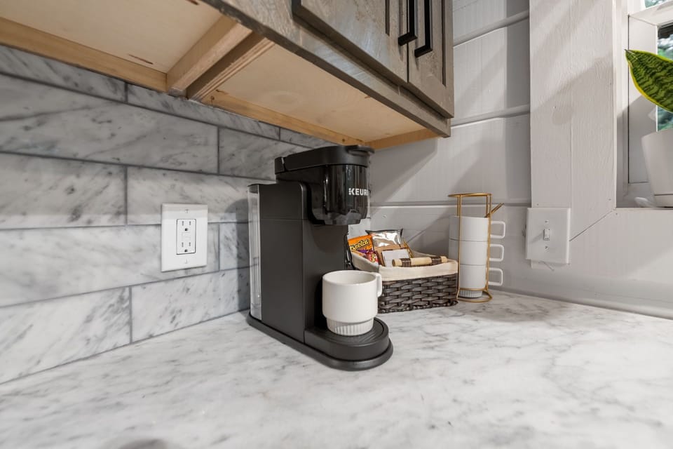 Our kitchen comes stocked with a Keurig coffee maker, perfect for your morning brews.