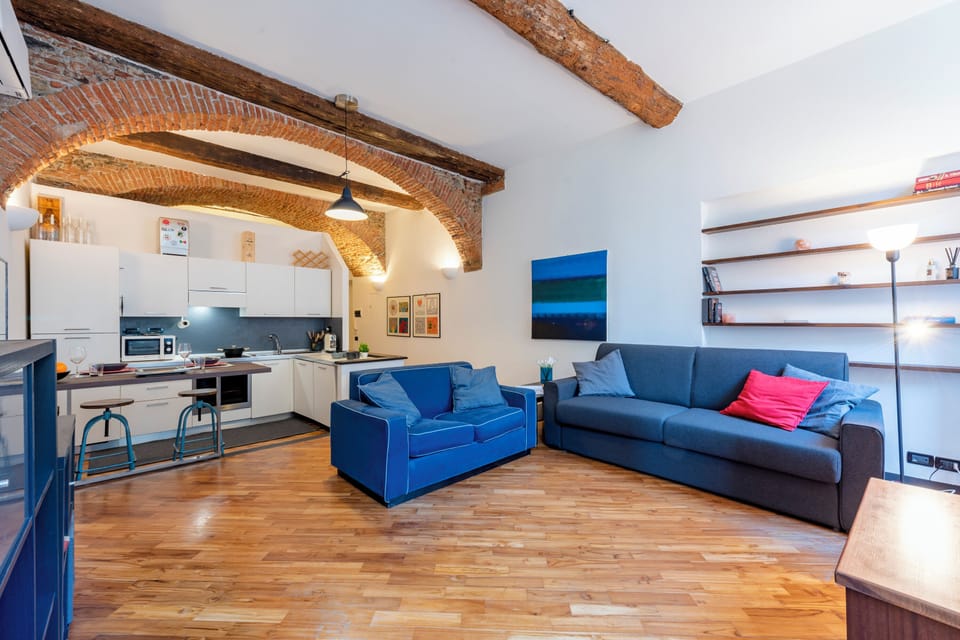 Family Apartment, Multiple Bedrooms (Charming Flat Next To Genoa's) | Living area | 21-inch flat-screen TV with cable channels