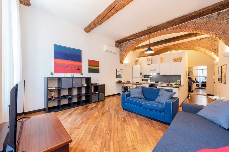 Family Apartment, Multiple Bedrooms (Charming Flat Next To Genoa's) | Living area | 21-inch flat-screen TV with cable channels