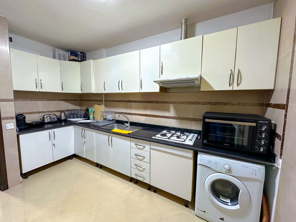 Deluxe Apartment | Private kitchen | Full-size fridge, oven, stovetop, espresso maker