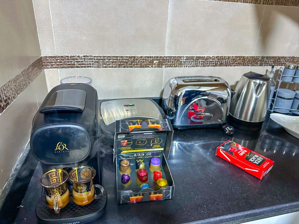 Deluxe Apartment | Private kitchen | Full-size fridge, oven, stovetop, espresso maker