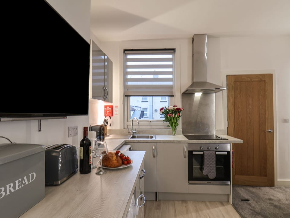 Fridge, electric kettle, toaster, cookware/dishes/utensils