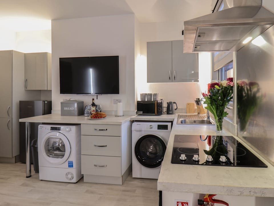 Fridge, electric kettle, toaster, cookware/dishes/utensils