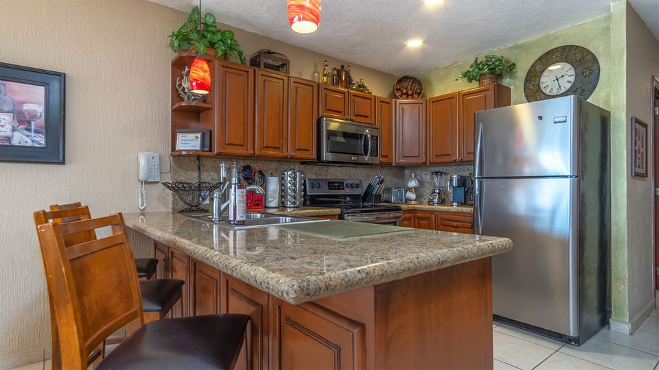 Fully Stocked Kitchen with Stainless Steel Appliances