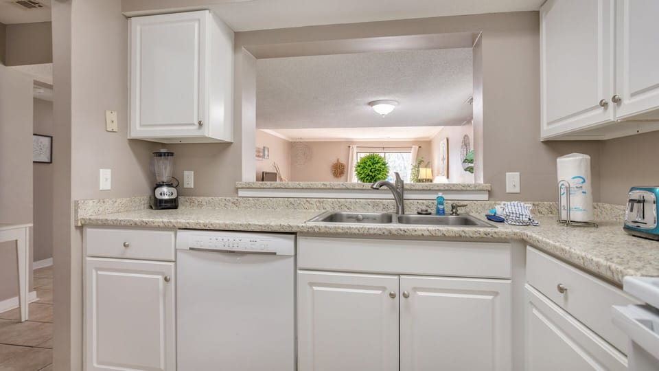 Connects seamlessly to the living space, creating a natural gathering spot for meals, conversation, or morning coffee.