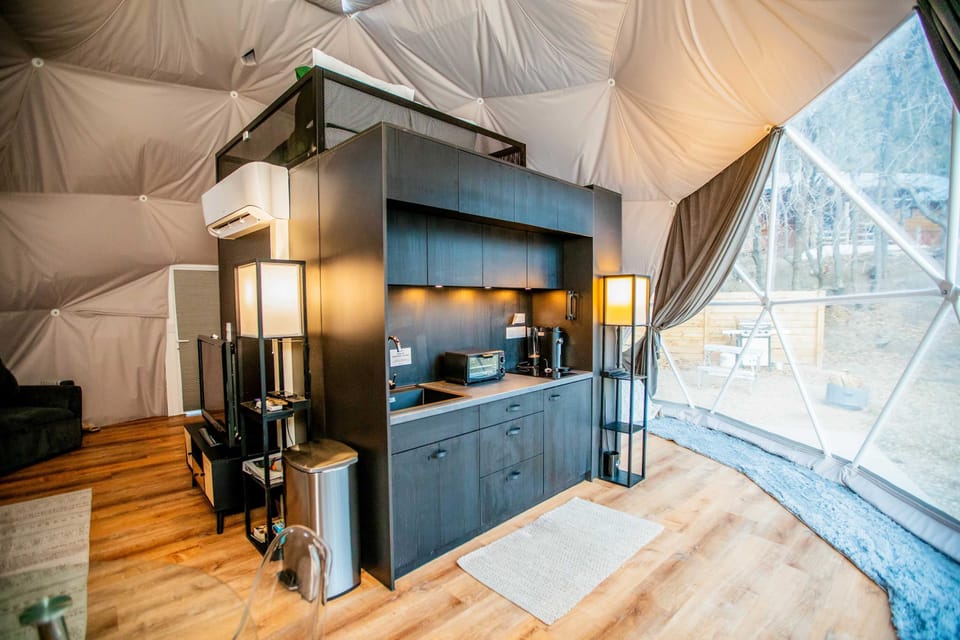 Need to whip up a quick meal or brew some coffee? Our kitchenette at Zen Zion Evergreen Dome has you covered! Mini fridge, sink, coffee machine, blender, toaster oven, cooktop, and cookware - everything you need for simple, delicious meals.