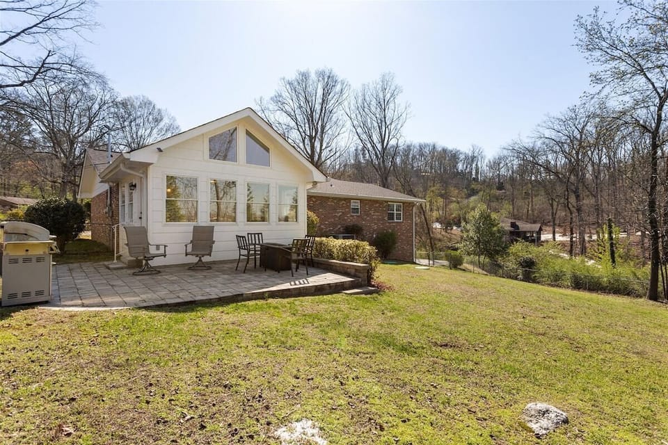 Back patio and fenced in backyard