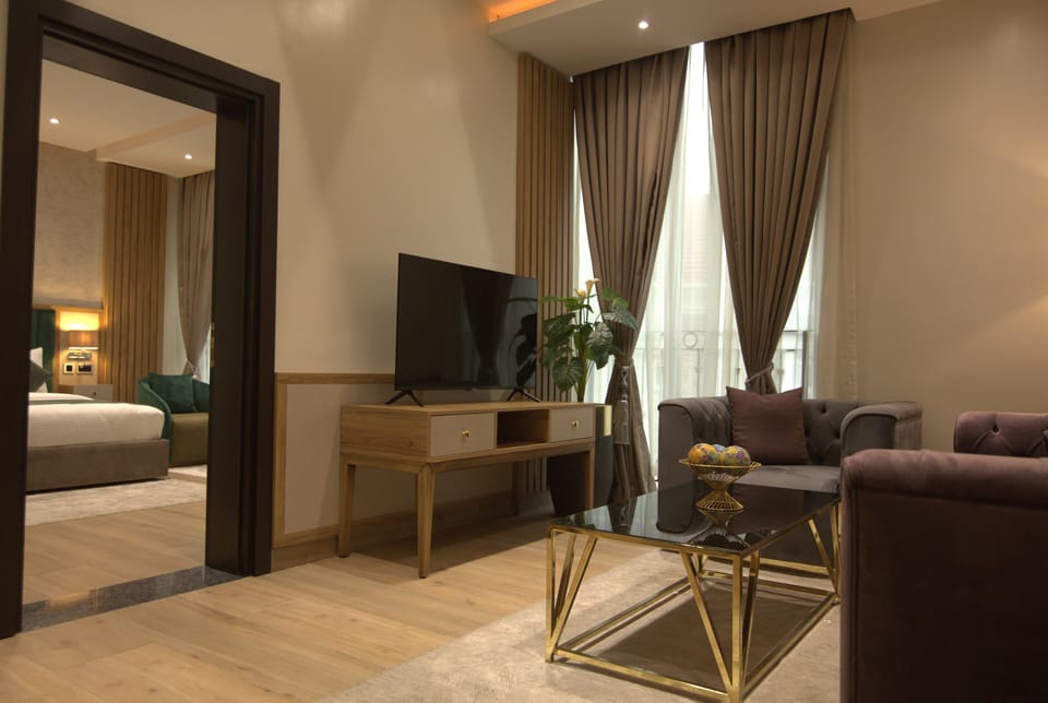 Premium Double Room, 1 Bedroom | Living area | TV