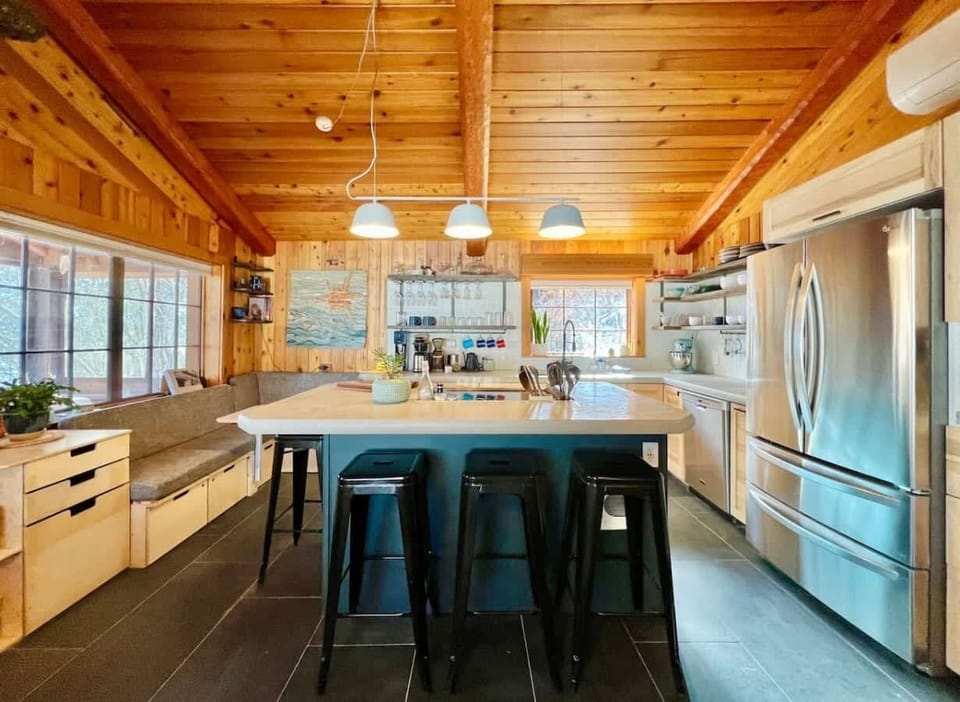 Full kitchen with island seating for dining 