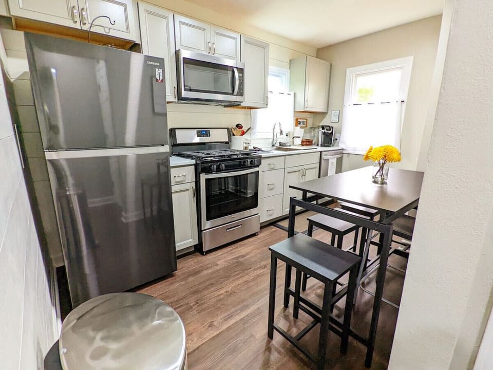 Kitchen offers stainless steel appliances with fridge, dishwater, stove, and microwave
