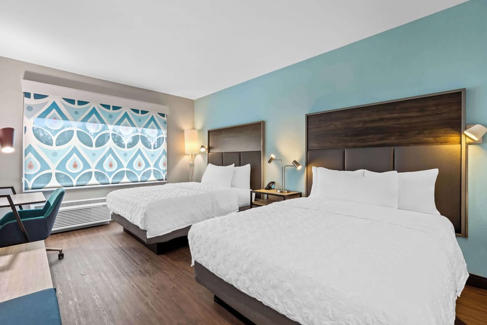 Desk, laptop workspace, blackout drapes, iron/ironing board