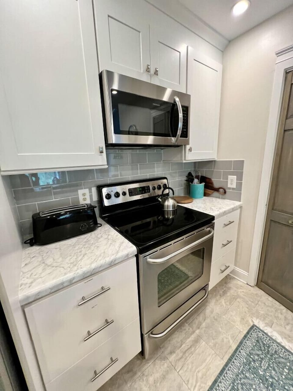 Stainless steel appliances and great countertop space-comes with stackable washer/dryer