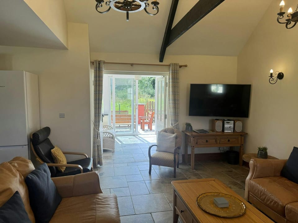 Patio doors leading from the sitting room to the conservatory