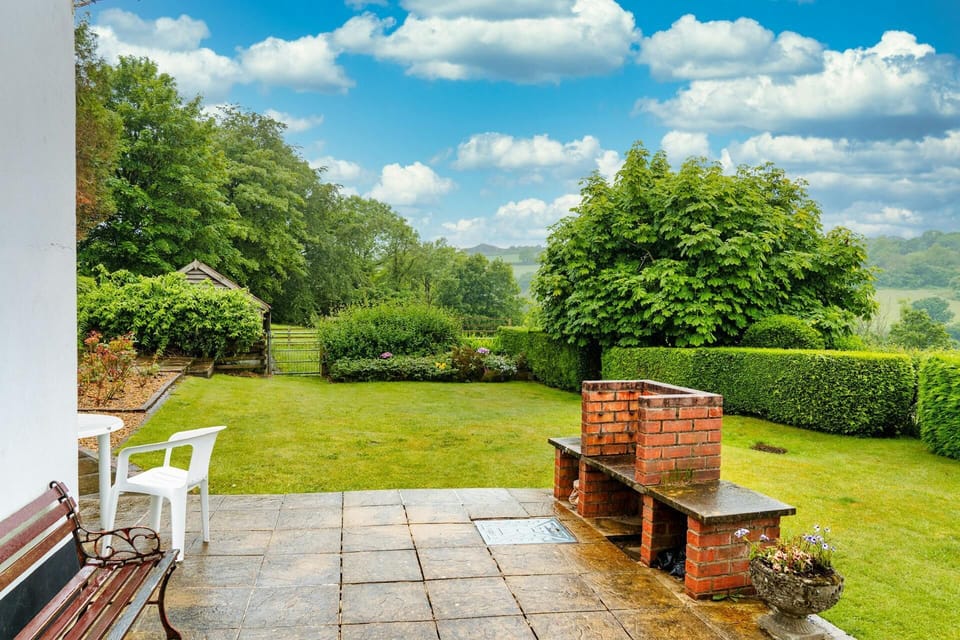 Patio with brick BBQ and patio bench