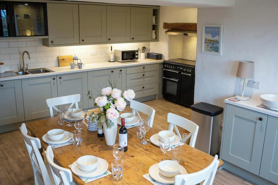 dining room table to seat 6 with kitchen and sideboard in the background