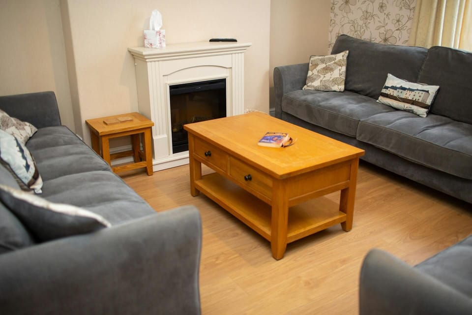 Three large sofas and coffee table