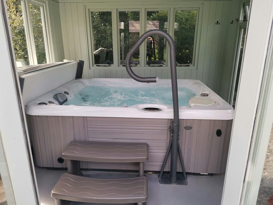 Hot tub in covered conservatory