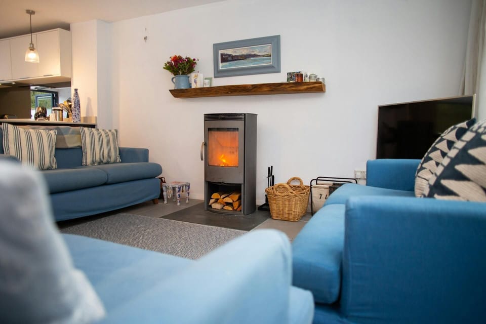 Sofas, TV and wood burner