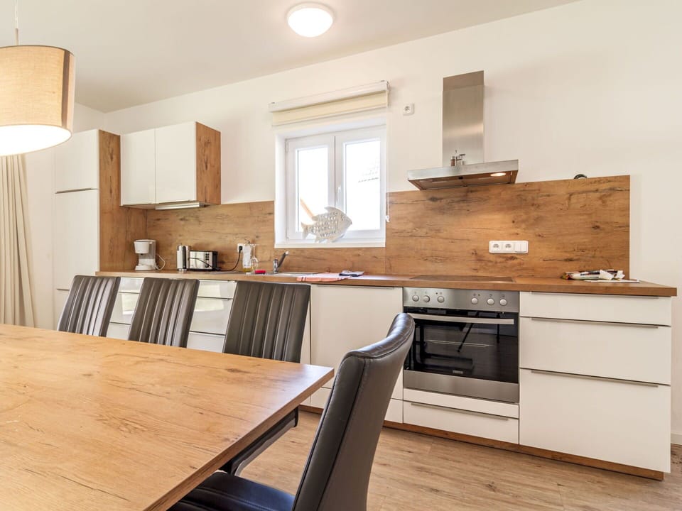 Cabinetry, Countertop, Property, Furniture, Building, Table, Sink, Wood, Kitchen Stove, Kitchen