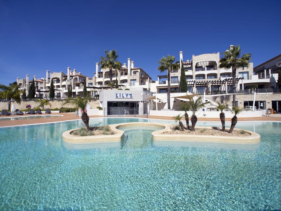 Water, Building, Sky, Plant, Azure, Tree, Arecales, House, Leisure, Aqua