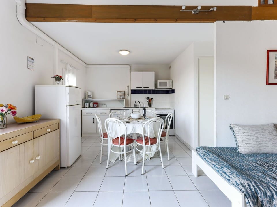 Cabinetry, Countertop, Furniture, Wood, Building, Lighting, Table, Flooring, Kitchen