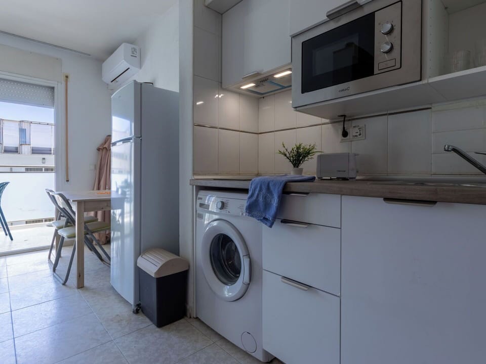 Washing Machine, Major Appliance, Flooring, Floor, Countertop, Kitchen Appliance, Clothes Dryer, Laundry Room, Interior Design, Kitchen