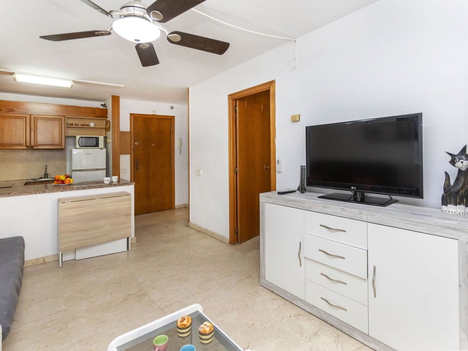 Cabinetry, Furniture, Property, Ceiling Fan, Building, Television, Drawer, Home Appliance, Door, Interior Design