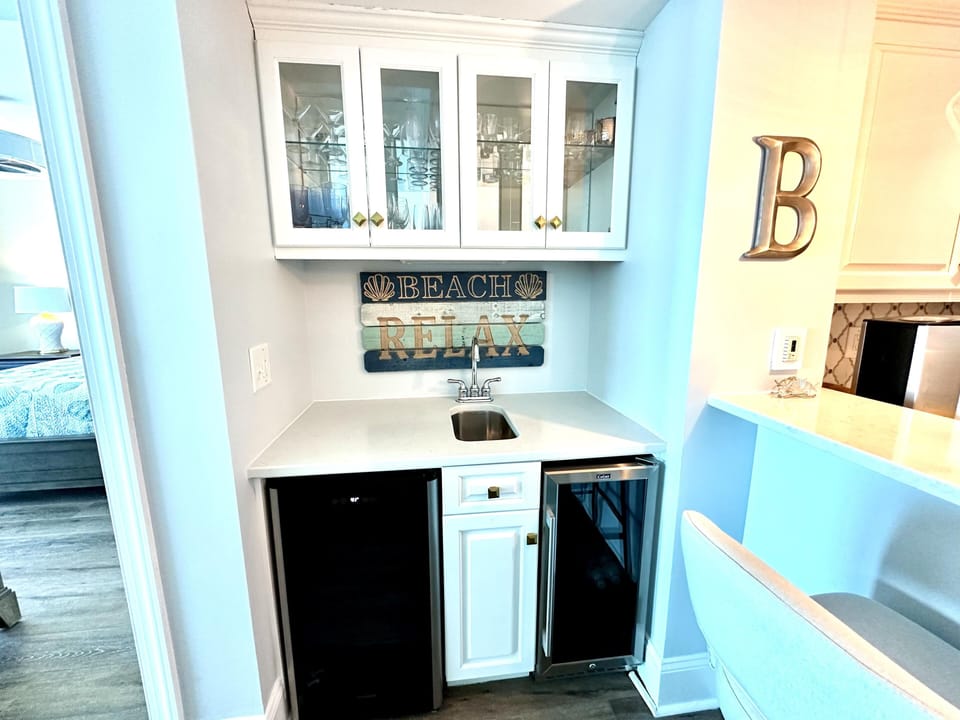 Bright kitchenette with ample storage and modern appliances