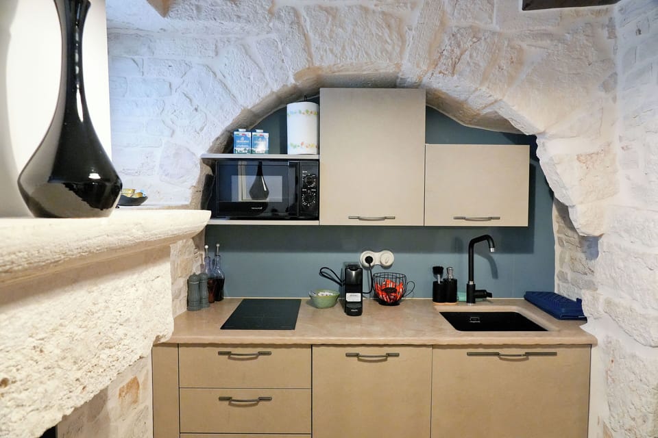 Trullo Superior | Private kitchen | Full-size fridge, microwave, stovetop, dishwasher