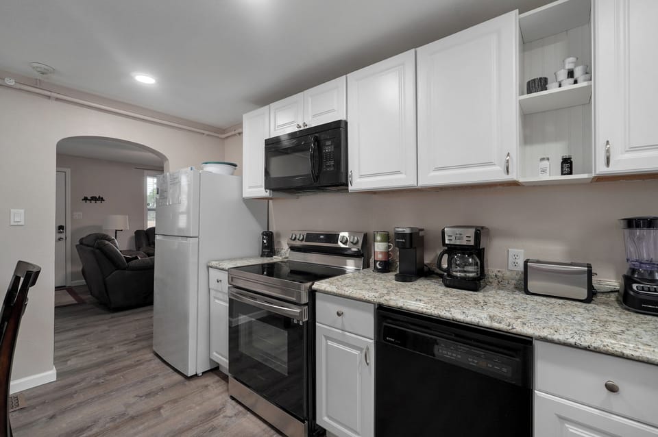 Kitchen with living room through the doorway.