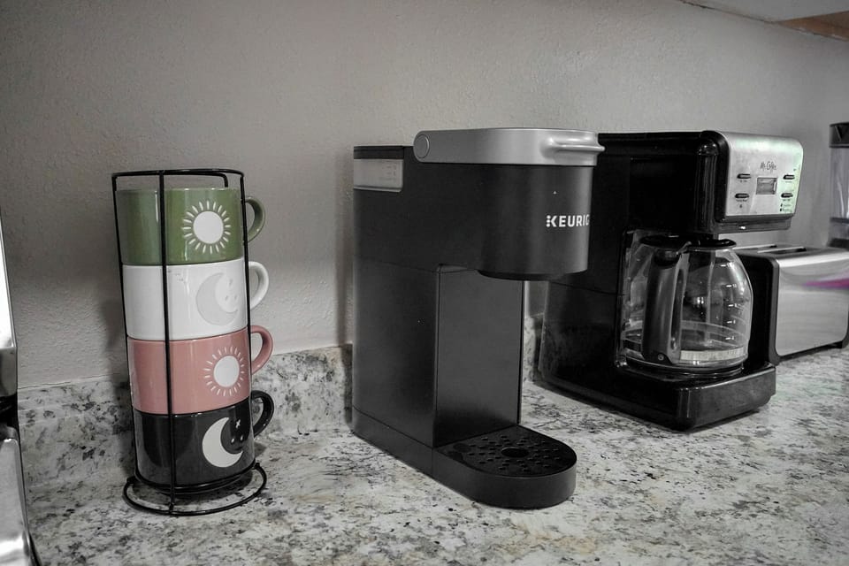 Keurig and coffee pot.