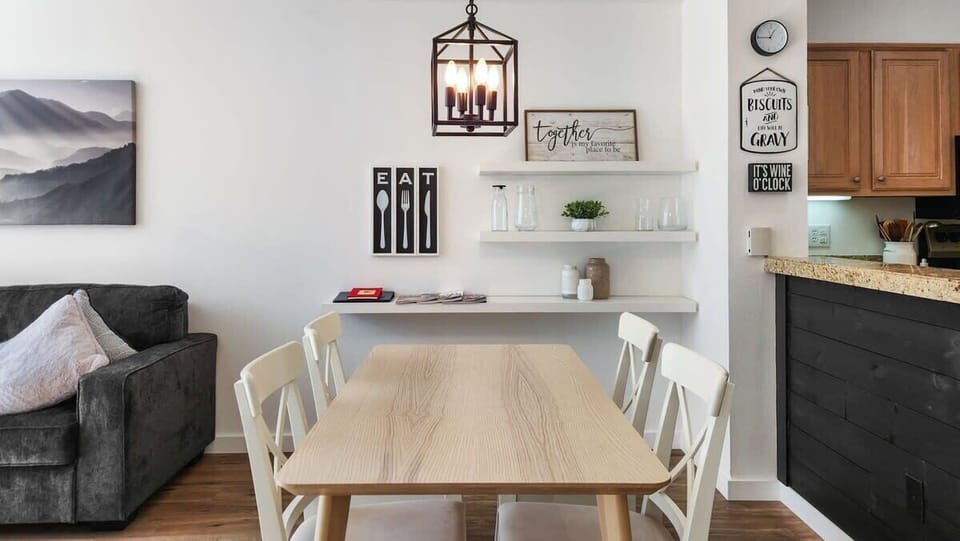 A dining table with seating for 4 provides a comfortable space to enjoy a meal with a view.