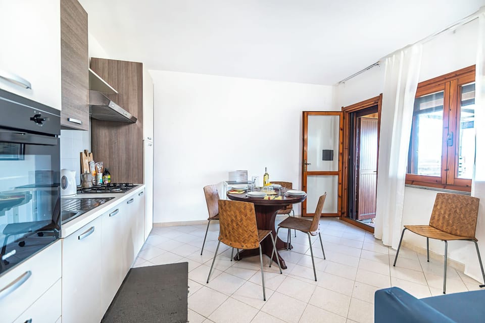 Standard Townhome, Multiple Bedrooms (3 Le Perle Di Stintino) | Private kitchen | Fridge, oven, stovetop, coffee/tea maker