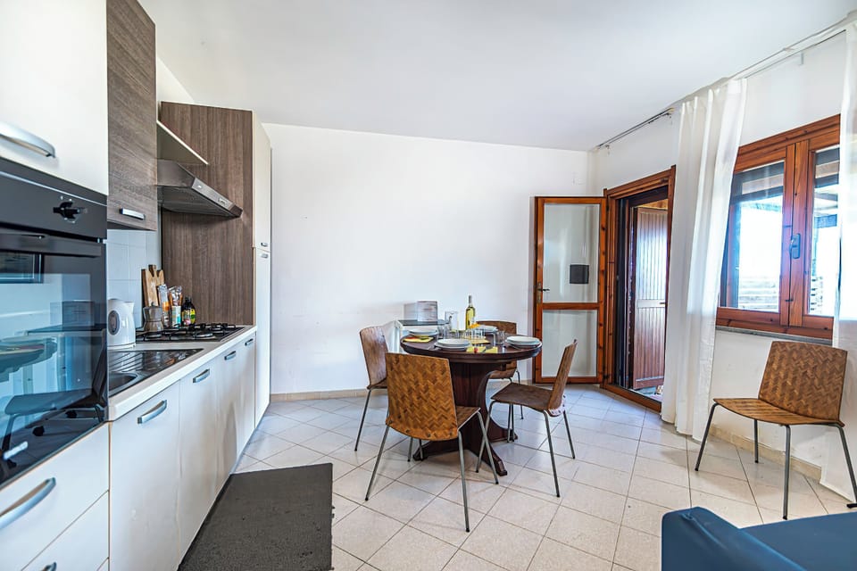 Standard Townhome, Multiple Bedrooms (3 Le Perle Di Stintino) | Private kitchen | Fridge, oven, stovetop, coffee/tea maker