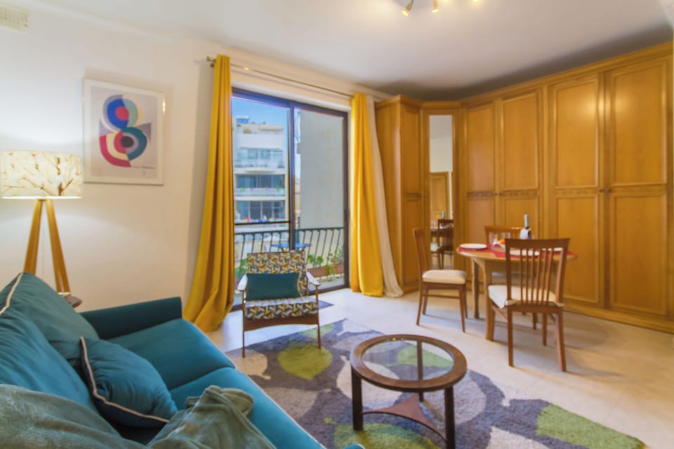 Family Apartment, Multiple Bedrooms, 2 Bathrooms (A Lovely Apart By The Sea Sliema) | Living area | 21-inch flat-screen TV with cable channels