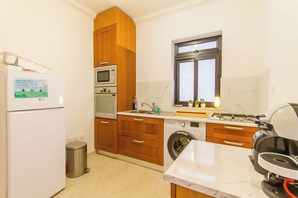 Family Apartment, Multiple Bedrooms, 2 Bathrooms (A Lovely Apart By The Sea Sliema) | Private kitchen | Fridge, microwave, stovetop, coffee/tea maker