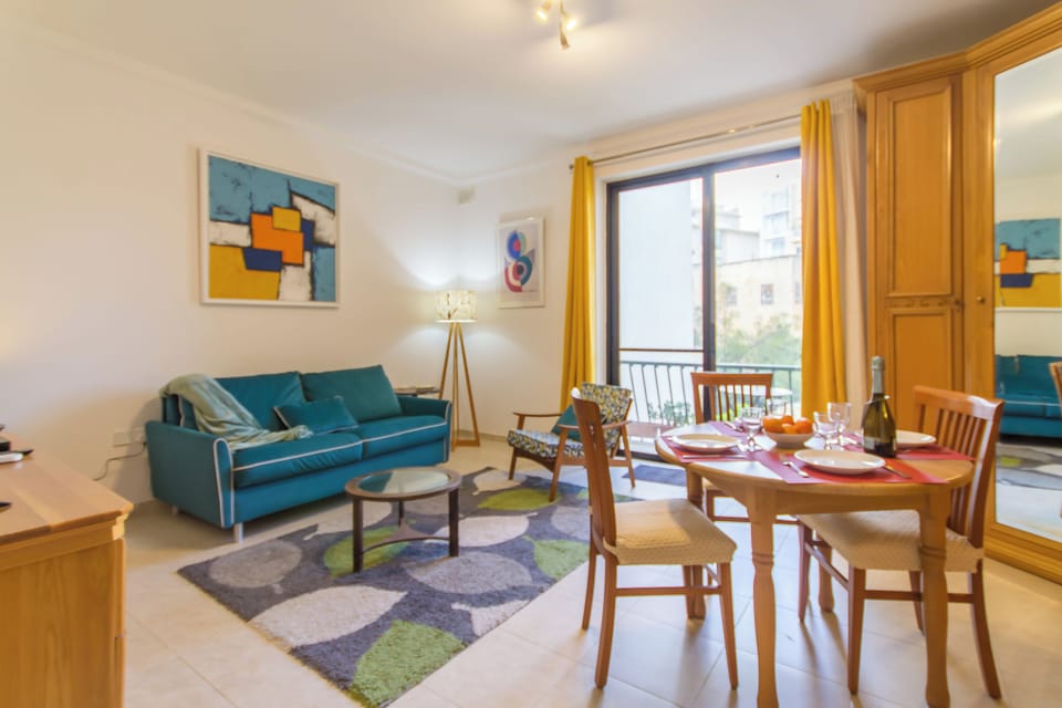 Family Apartment, Multiple Bedrooms, 2 Bathrooms (A Lovely Apart By The Sea Sliema) | Living area | 21-inch flat-screen TV with cable channels