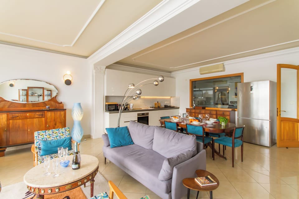 Family Apartment, Multiple Bedrooms, 2 Bathrooms (A Magnificent Sunny Seafront Apart) | Living area | 21-inch Smart TV with digital channels
