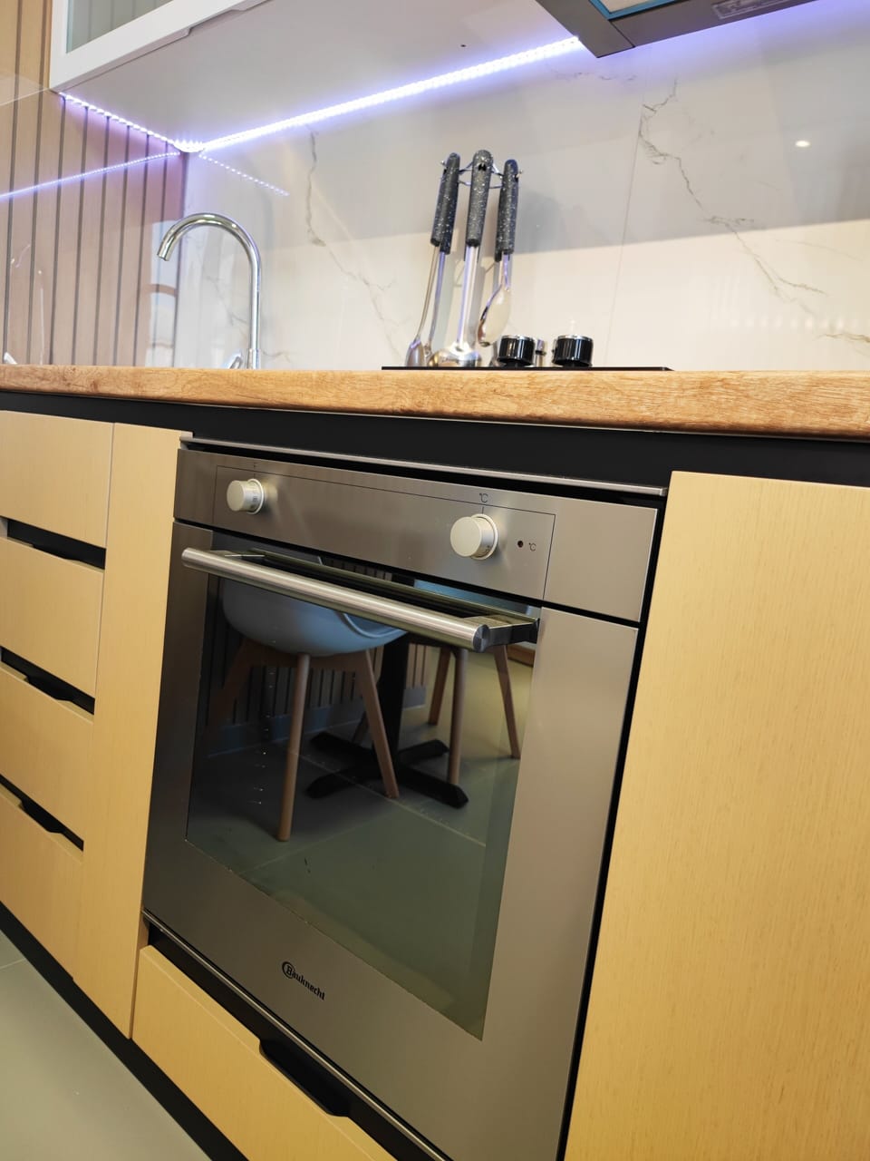 Modern oven and full cooking setup in the kitchen